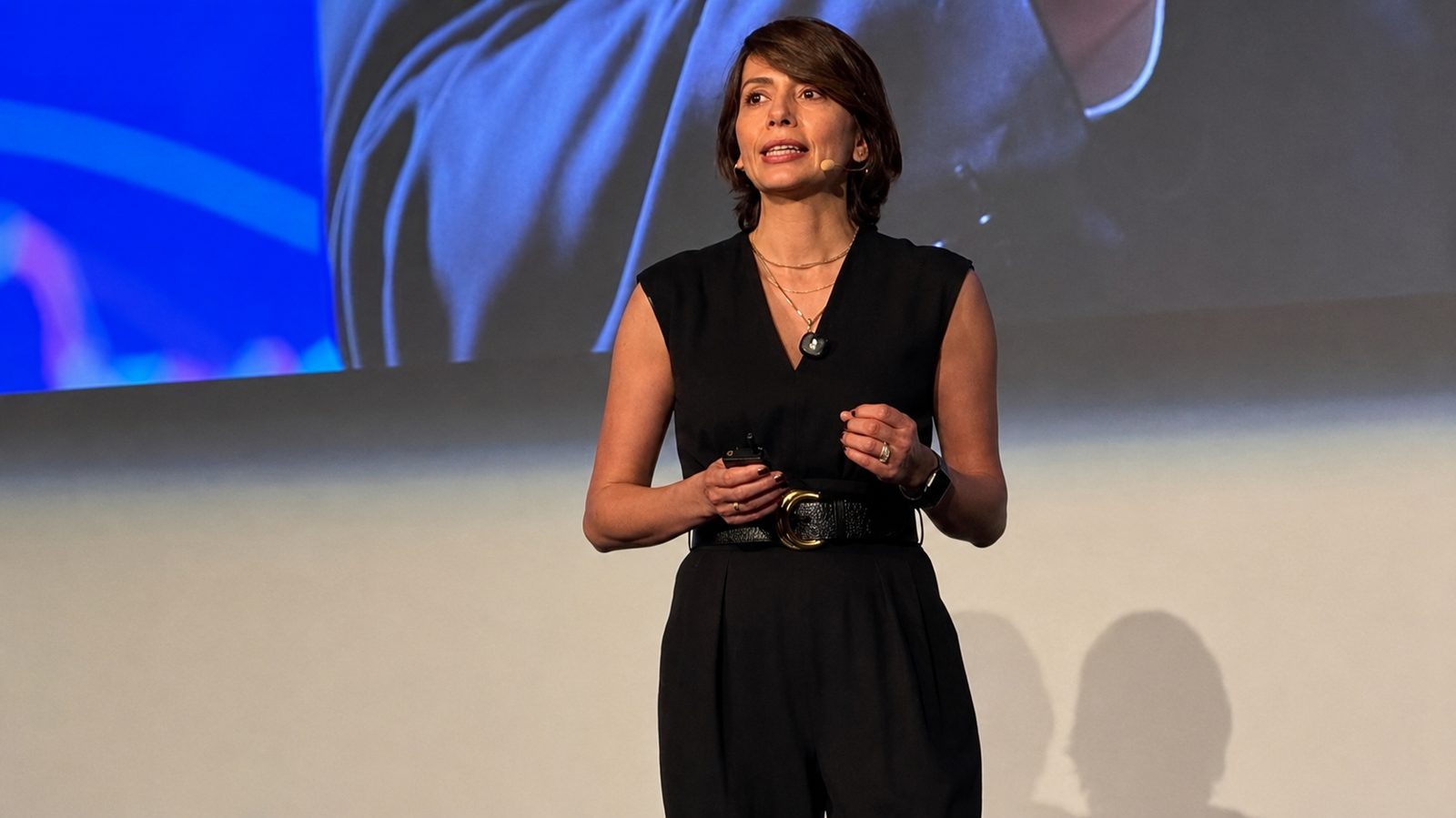 Dr. Sam Zolfagharian speaking on stage